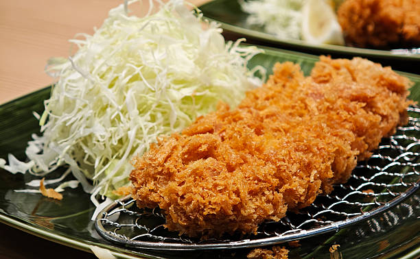 istock Pork cutlet and shredded cabbage on a plate 2253113763