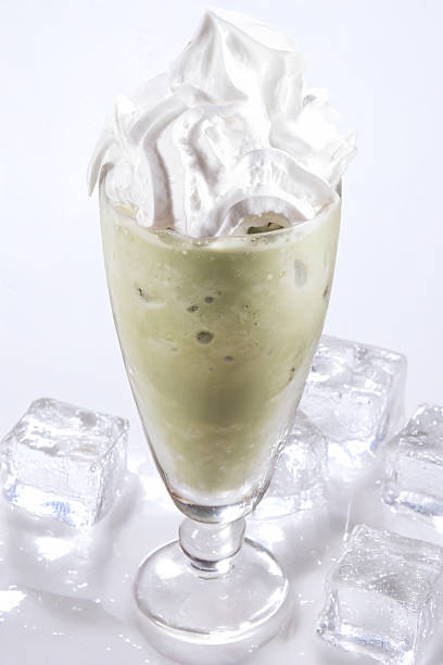 Matcha frappe glass with whipped cream