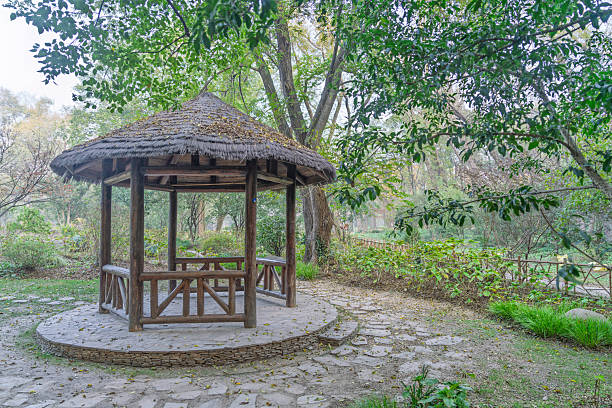 Stone paths and thatched pavilions in the garden.