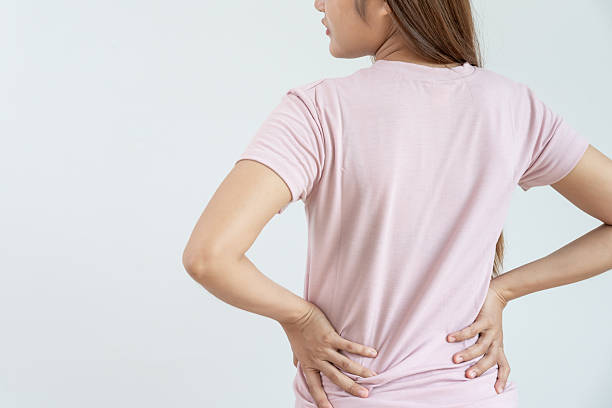 istock woman holding lower back while and suffer from unbearable pain health and problems, chronic back pain, backache in office syndrome, scoliosis, herniated disc, muscle inflammation 2253122617