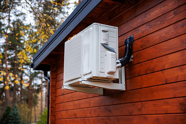 istock White split system heat pump on timber clad house exterior 2253123369