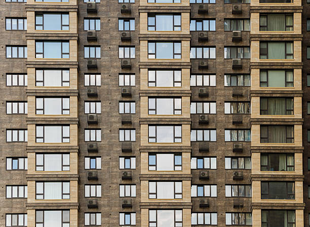 istock multi apartment living building complex modern huge architecture object in megapolis city scape golden colored walls and a lot windows 2253124561
