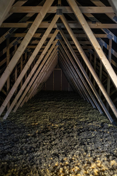 istock Narrow attic crawlspace with wooden trusses and insulation 2253124974