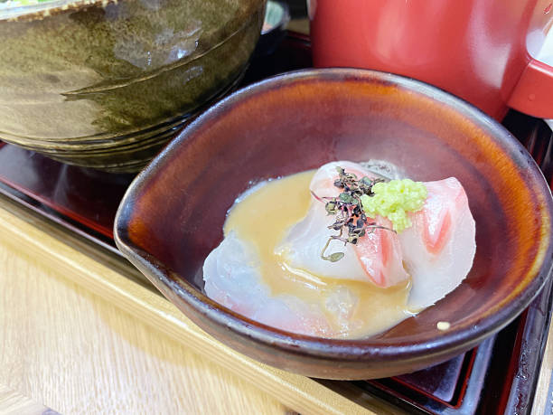 istock Sea bream on rice with green tea 2253126492