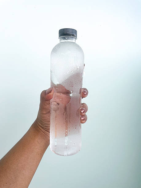 istock Selfie of cold drinking water bottle in hand 2253126569