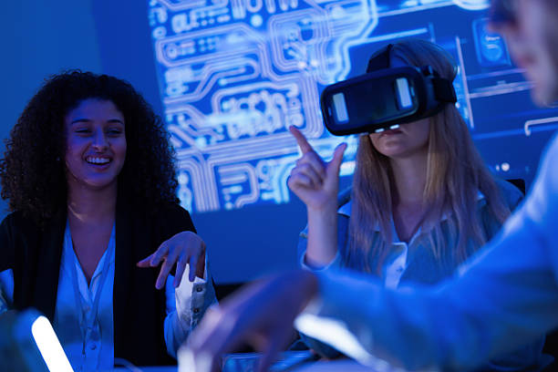 istock Group of professionals engaging in virtual reality training session in modern tech office environment 2253130954