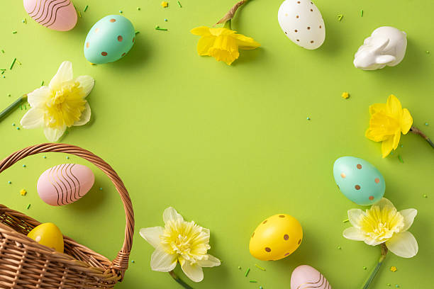 istock Bright Easter scene features pastel eggs, yellow daffodils, and a woven basket on a vivid green backdrop. Ideal for greeting, celebration, and spring renewal themes in holiday campaigns 2253131149