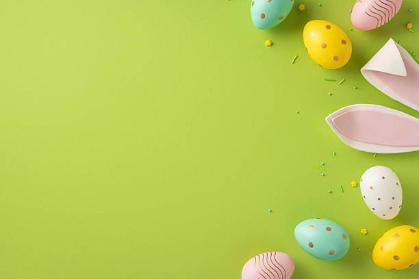 istock Vibrant Easter scene with colorful eggs and pastel bunny ears on a vivid green backdrop evokes celebration, renewal, and cheerful greetings for springtime 2253131150