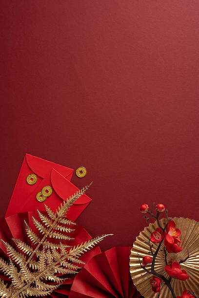 istock Rich vertical red backdrop with envelopes, coins, and decorative elements evokes the Chinese New Year mood. Ideal for greeting messages 2253131287