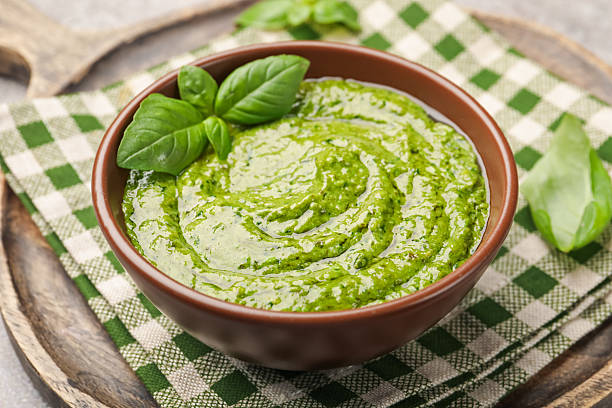 istock Fresh pesto sauce with basil leaves in bowl on table, closeup 2253133431