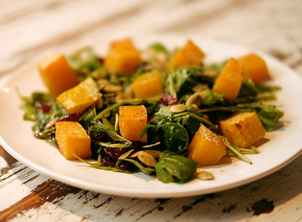 salad with pumpkin, pumpkin seeds and arugula