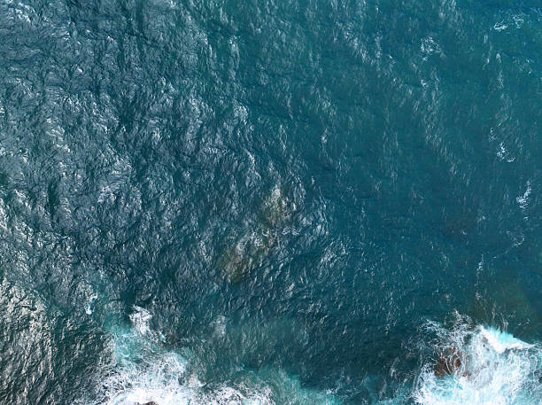 Waves top view, flying a drone over the Atlantic ocean, sea background without people, aqua with clear turquoise blue water,