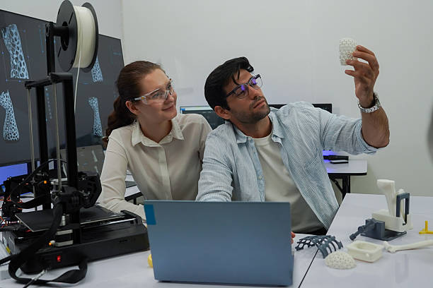 istock Researchers are working with a 3D printer to print clear, white plastic models using cutting-edge, focused technology in the lab 2253141600