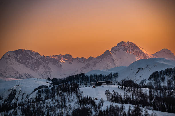 istock Alpine mountains and ski resort at sunset 2253141679