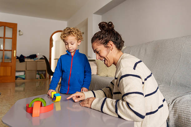 istock Mother and son playing with colorful building blocks 2253142793