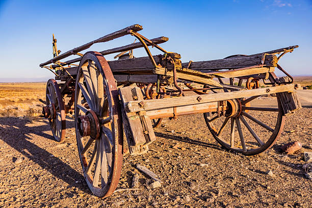 istock Vintage ox wagon abandoned in arid desert 2253144018