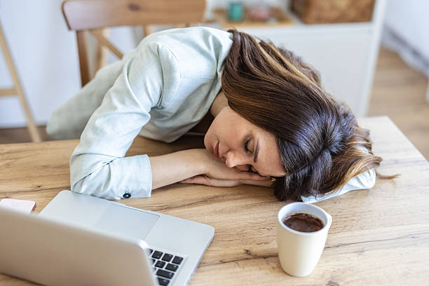 istock Tired, sleeping and woman on laptop for remote work exhausted for project, report and working from home. Stress, overworked and female person with burnout for nap, relaxing and resting from fatigue. 2253150433