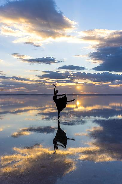 istock Silhouette Ballet Dancer at Sunset on Reflective Salt Lake 2253150859