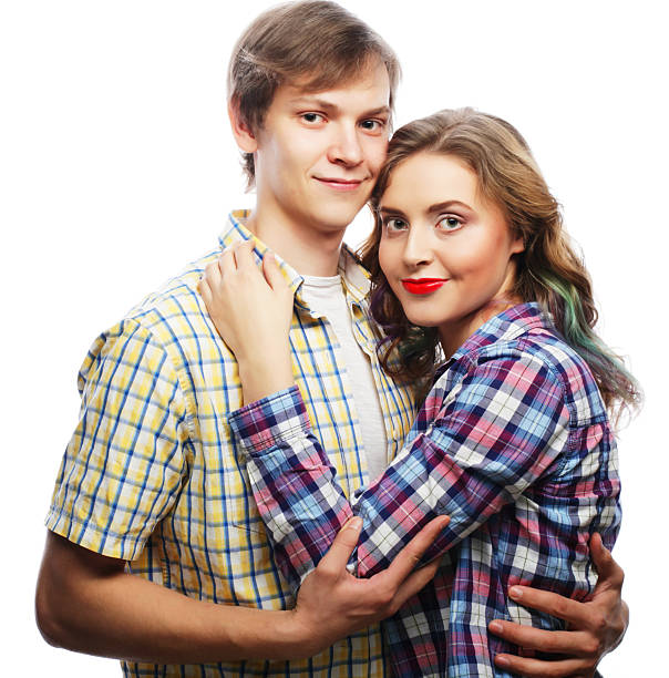 Love, family and people concept: lovely happy couple hugging over white background.