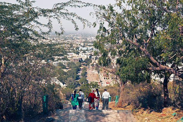 Palitana, Gujarat / India - January 14, 2016: Jain pilgrims descend the long staircase leading to the city