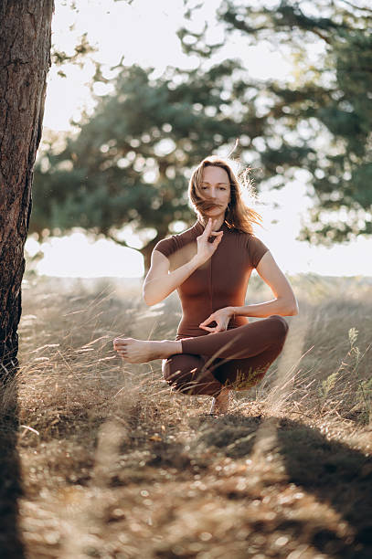 istock Woman practicing yoga in nature. 2253160581