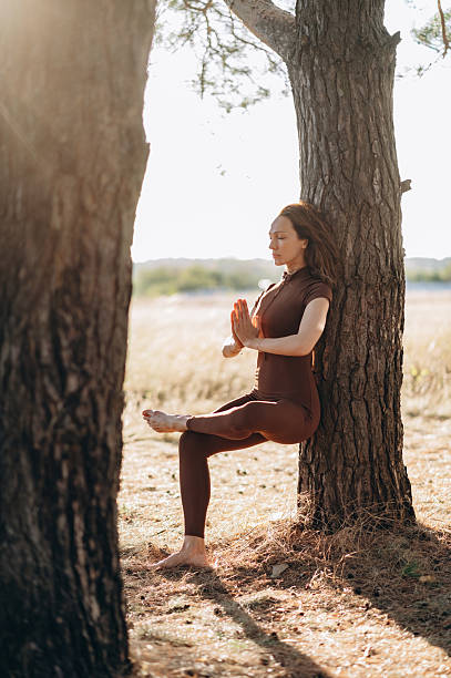 istock Woman practicing yoga in nature. 2253160915