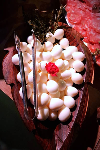 istock A wooden platter with quail eggs and a red decorative flower 2253161156