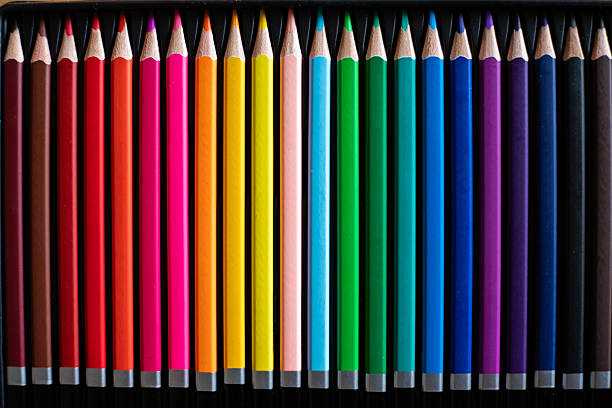 Complete set of colored pencils aligned horizontally.