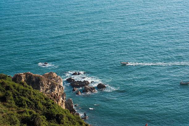 istock Turquoise Ocean Meets Green Coastal Cliffs 2253164741
