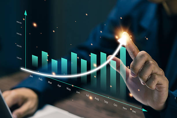 istock A professional points at a rising business chart showing monthly performance growth, representing financial success, revenue increase, strategic planning, KPI analysis, and corporate forecasting. 2253164868