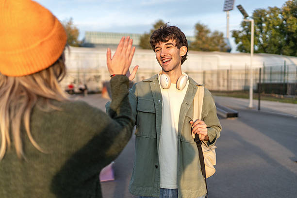 istock Teenagers giving high five at skatepark during sunset 2253166336