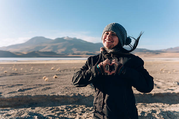 Woman making heart shape with hands