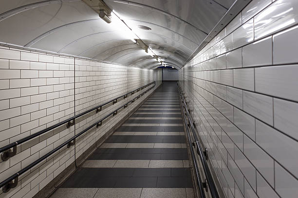 istock Empty Underground Subway Tunnel with White Tiles 2253171314