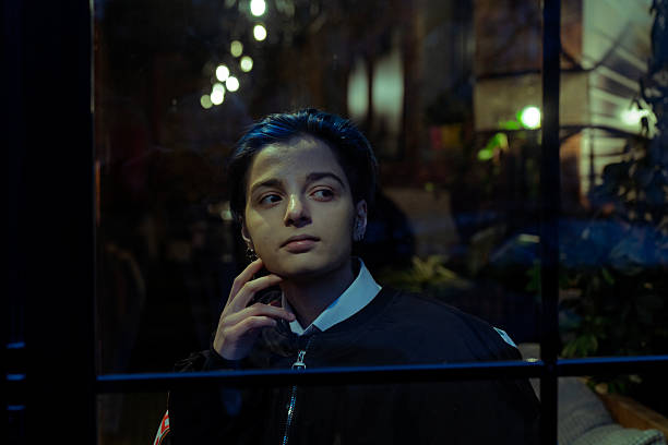 Portrait of an adult young beautiful brunette girl in a cafe