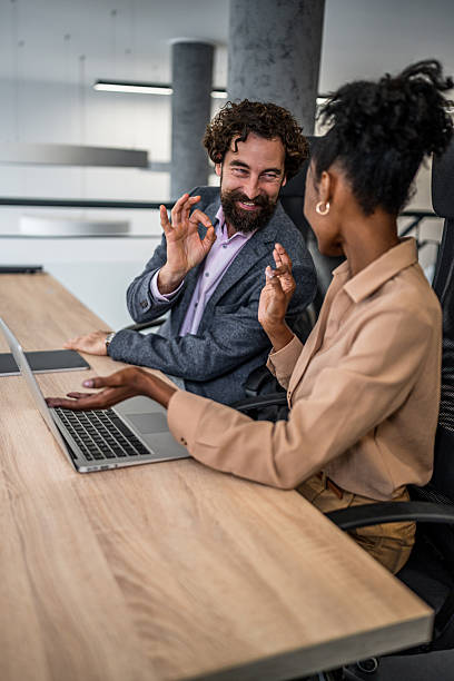 istock Business colleagues collaborating on laptop in modern office 2253173452