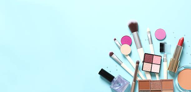 istock Professional decorative cosmetics, make-up products and accessories on blue background, minimal style. Top view, space for text 2253174307