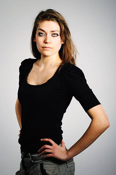 studio portrait of a slim girl on a white background