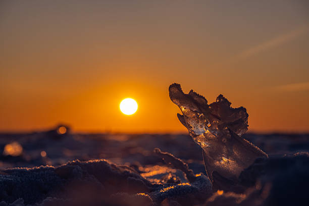 Transparent ice against the sunset