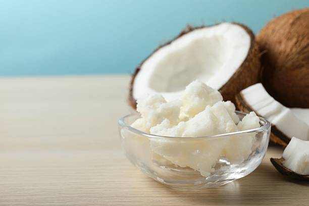 istock Bowl of coconut oil on table 2253176187