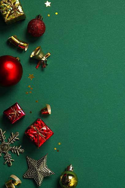 istock Top view of Christmas decorations, confetti on green background 2253177199