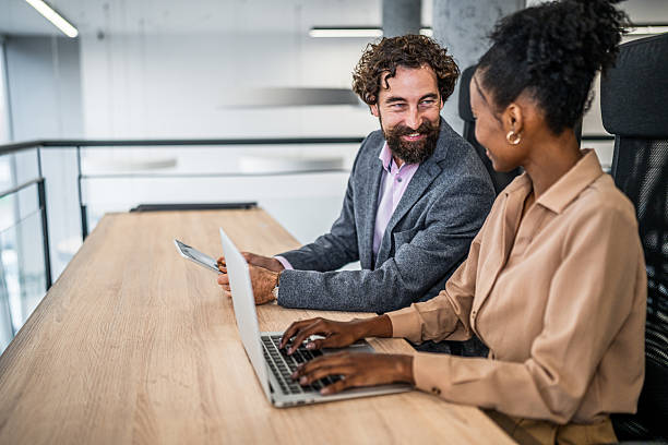istock Business colleagues collaborating on project during office meeting 2253177257