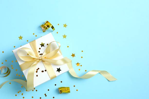 istock Beautiful festive gift box on color background 2253177769