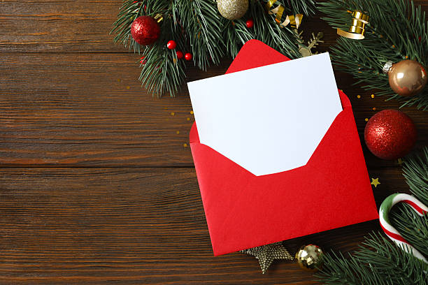 istock Festive Christmas background with paper envelope, different decorations, balls and confetti 2253177823