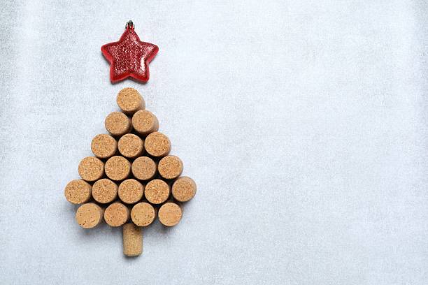 istock Christmas tree shaped wine corks on grey background. Top view with copy space for text 2253178629