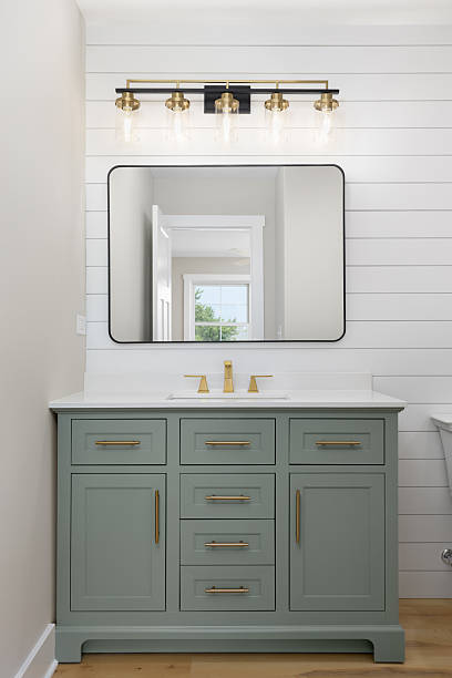istock A bathroom with a green cabinet and white shiplap wall. 2253179029