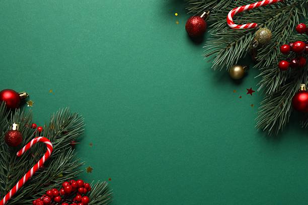 istock Festive Christmas background with green fir tree branches and various decorations, top view 2253179078