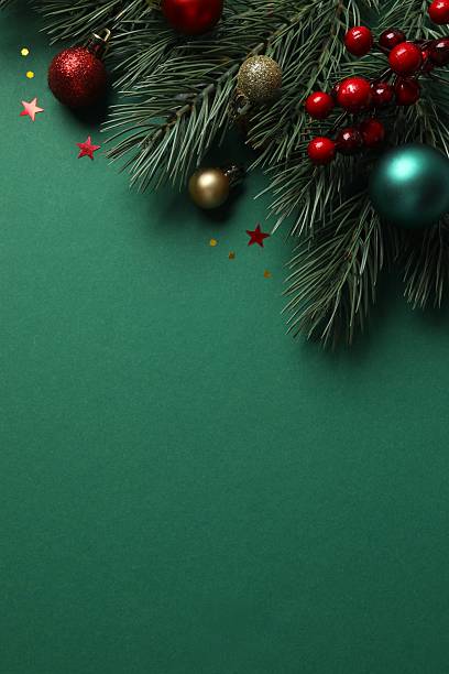 istock Festive Christmas background with green fir tree branches and various decorations, top view 2253179103