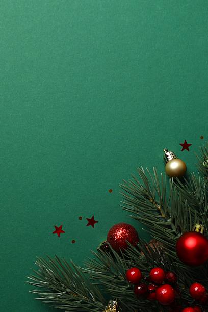 istock Festive Christmas background with green fir tree branches and various decorations, top view 2253179110