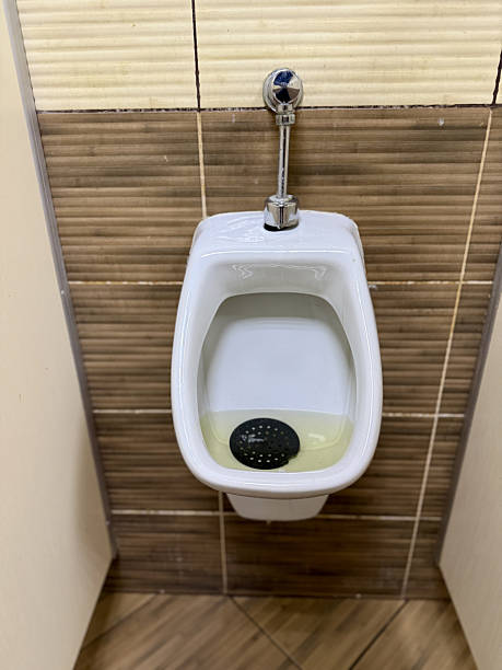 istock Dirty Urinal Needs Urgent Cleaning, Neglected Bathroom Features Staining And Hygiene Issues Present, Inspection Reveals Grimed Urinal With Discoloration And Poor Sanitation Standards 2253179145
