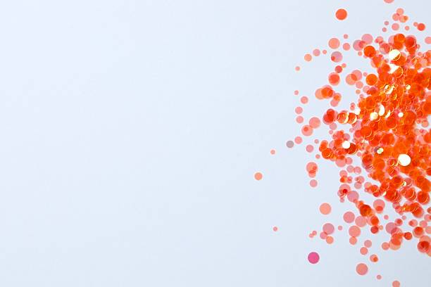 istock Beautiful orange confetti on a white background 2253179302